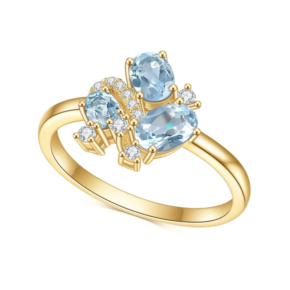 18K yellow gold natural blue topaz dainty cluster ring—oval center with accents