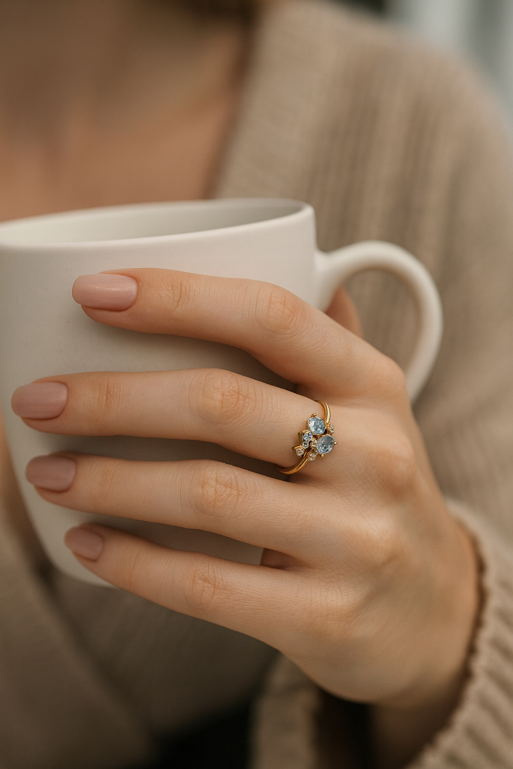Close-up prong-set blue topaz gemstone cluster on polished gold band