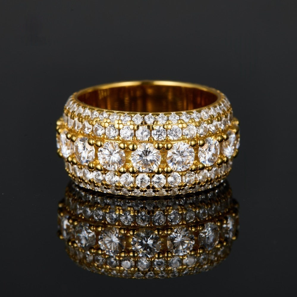 Gold pavé moissanite-inspired wide band ring with vintage statement design on black background