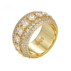Gold pavé moissanite-inspired wide band ring with vintage statement design on black background