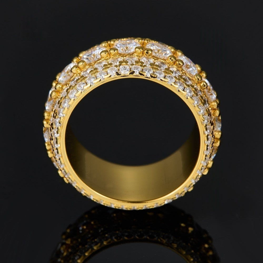 Gold pavé moissanite-inspired wide band ring with vintage statement design on black background
