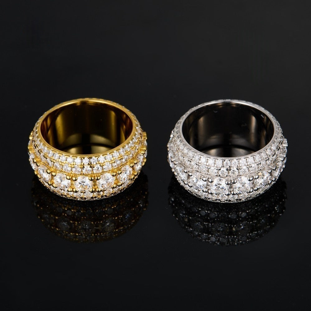 Gold pavé moissanite-inspired wide band ring with vintage statement design on black background