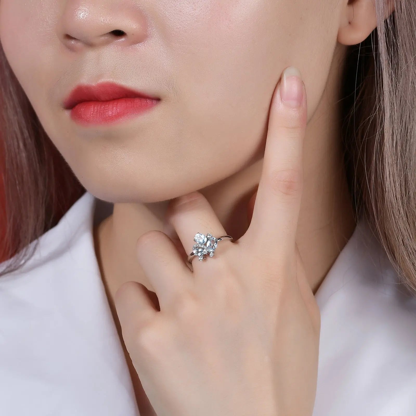 Stacking style—blue topaz gold ring paired with thin pavé band