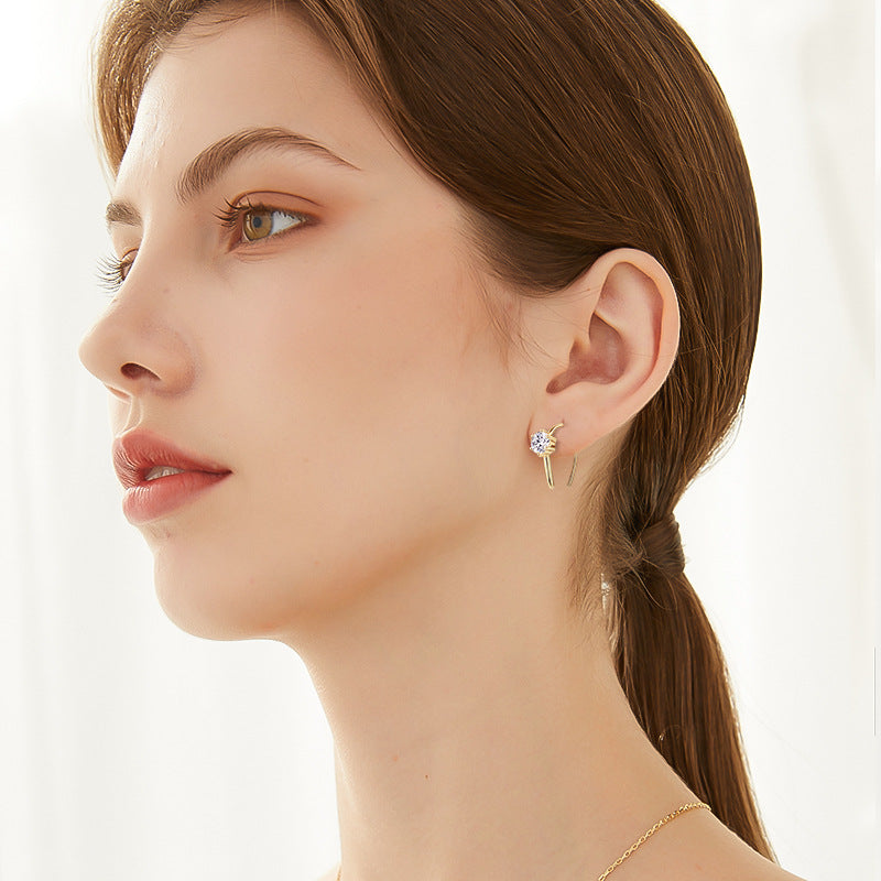 Minimalist moissanite U-hoop earrings styled on ear — Verse & Hue Jewelry