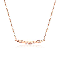 Close-up of Lucky Bar diamonds set in 18K rose gold — Verse & Hue Jewelry
